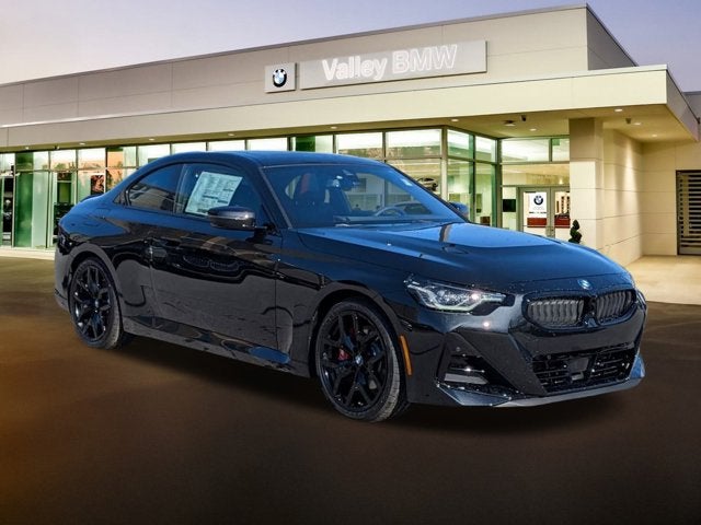 2026 BMW 2 Series 230i in Black Sapphire Metallic — front three-quarter view
