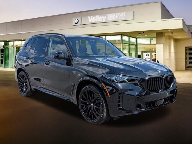 2026 BMW X5 xDrive40i in Black Sapphire Metallic — front three-quarter view