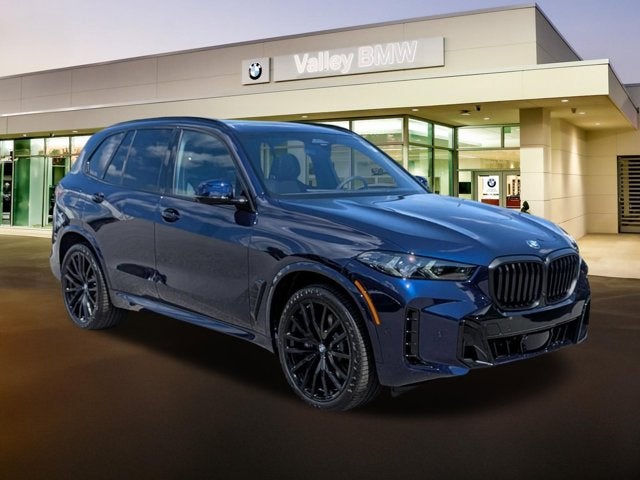 2026 BMW X5 xDrive40i in Tanzanite Blue II Metallic — front three-quarter view