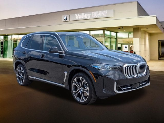 2026 BMW X5 xDrive40i in Black Sapphire Metallic — front three-quarter view