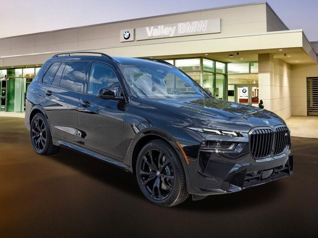 2027 BMW X7 M60i in Black Sapphire Metallic — front three-quarter view