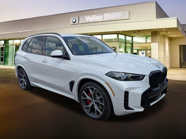2026 BMW X5 xDrive50e in Mineral White Metallic — front three-quarter view