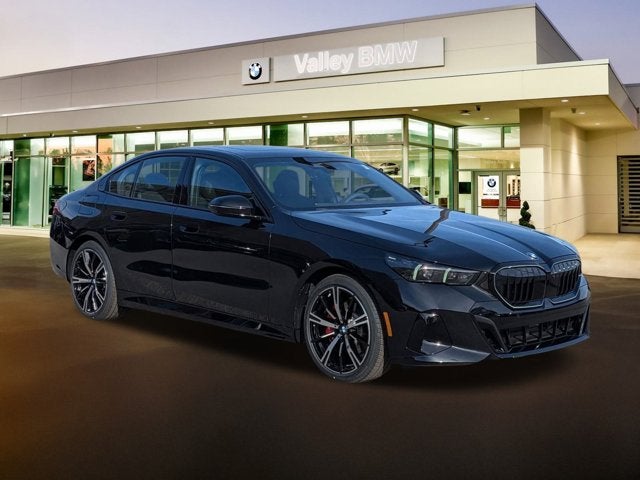 2026 BMW 5 Series 530i in Black Sapphire Metallic — front three-quarter view