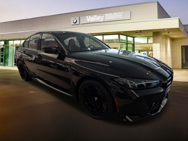 2027 BMW M3 Competition in Black Sapphire Metallic — front three-quarter view